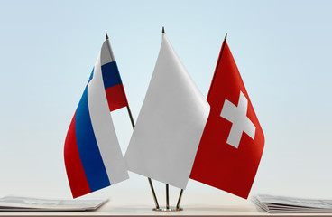 Flags of Slovenia and Switzerland with a white flag in the middle