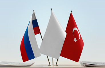 Flags of Slovenia and Turkey with a white flag in the middle