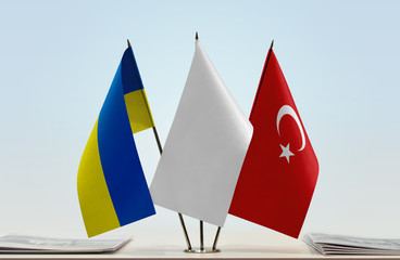 Flags of Ukraine and Turkey with a white flag in the middle