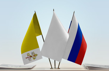 Flags of Vatican City and Russia with a white flag in the middle