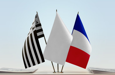 Flags of Brittany and France with a white flag in the middle