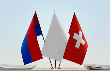 Flags of Canton of Ticino and Switzerland with a white flag in the middle