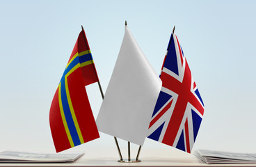 Flags of Orkney and Great Britain with a white flag in the middle