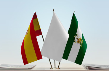 Flags of Spain and Andalusia with a white flag in the middle