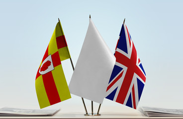 Flags of Ulster and Great Britain with a white flag in the middle