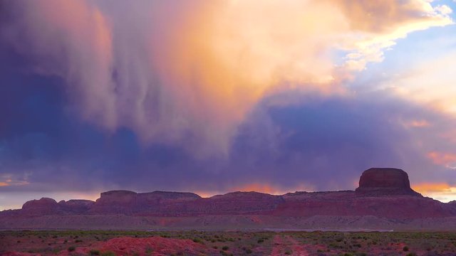 Beautiful rain clouds rolling above buttes near Monument Valley, Utah.