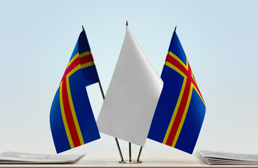 Two flags of Aland with a white flag in the middle