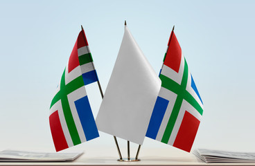 Two flags of Groningen with a white flag in the middle
