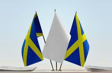 Two flags of Mercia with a white flag in the middle
