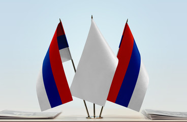 Two flags of Republika Srpska with a white flag in the middle