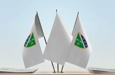 Two flags of Sanjak with a white flag in the middle