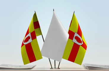 Two flags of Ulster with a white flag in the middle