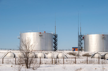 Obraz premium fuel storage tanks in the protected area in winter
