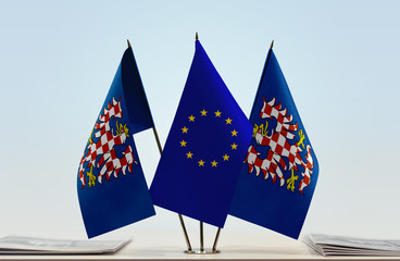 Two flags of Moravia and European Union flag between