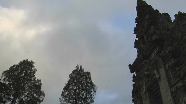 The clouds pass over a Balinese temple in Bali, Indonesia.