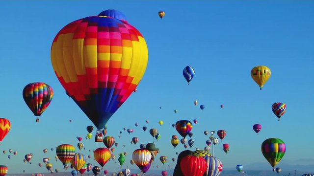 Balloons float across the sky at the Albuquerque balloon festival.