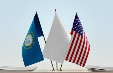 Flags of South Dakota and USA with a white flag in the middle