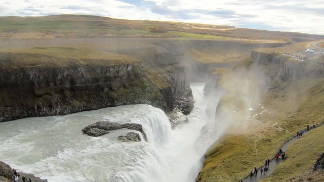 epic view on icelandic waterfall Gullfoss and Hvita river valley at the bottom, tourists are walking