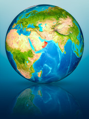 Oman on Earth on reflective surface