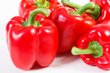 Red peppers on white background, concept of healthy nutrition