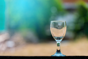 Empty wine glass on blurred background