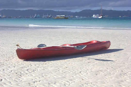 the boat on sand by the sea on the island Borakay, Philippines