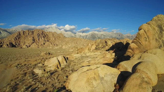 A high aerial sunset shot over the Alabama Hills outside Lone Pine California with Mt. Whitney and Sierras background.