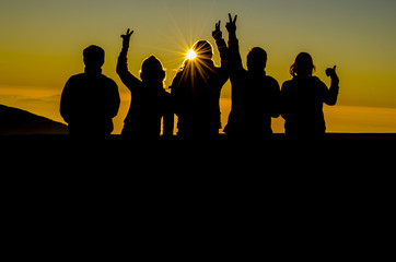 silhouette of family visiting winter mountain scenery.Thailand