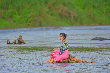 Portrait of young girl in river