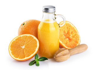 Bottle with orange juice, oranges, squeezer and mint isolated on white background.