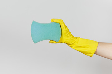 Close up of female hand in yellow gloves horizontal holds blue large sponge for cleaning and...