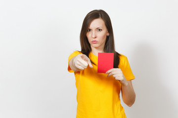 European serious severe young woman, football referee in yellow uniform show red soccer card,...