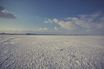 snow covered beach and sea