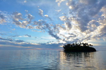 Taakoka islet at sunrise Muri lagoon Rarotonga Cook Islands