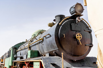 Naklejka premium Steam locomotive, still in use, in the desert of Wadi Rum, Jordan