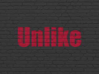 Obraz premium Social network concept: Painted red text Unlike on Black Brick wall background