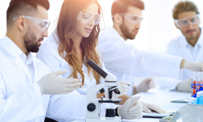 young scientists discussing the results of experiments in the la