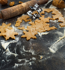 Cooking Christmas cookies with snowflake cookie cutters
