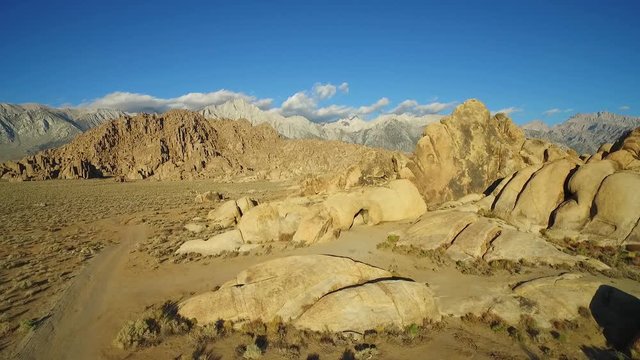 A high aerial sunset shot over the Alabama Hills outside Lone Pine California with Mt. Whitney and Sierras background.