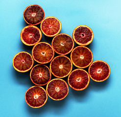 Citrus fruit pattern on blue background. Flat lay concept.