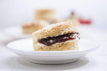 Close-up Scones with butter and strawberry jam