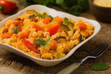 Millet with vegetables and raisins.