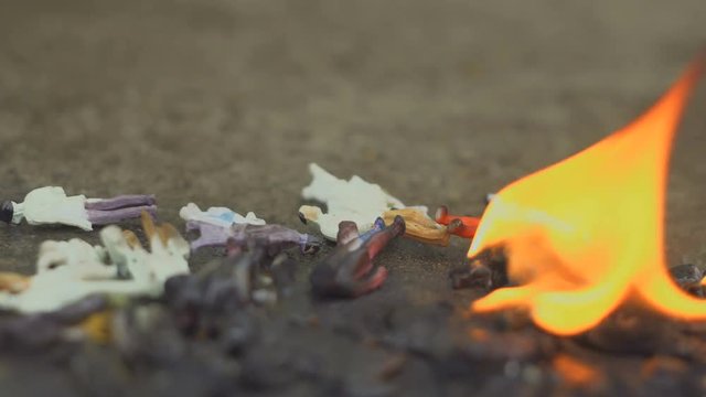 Burning people. Models of people are burning. The concept of aggression, ecology, danger. 4k
