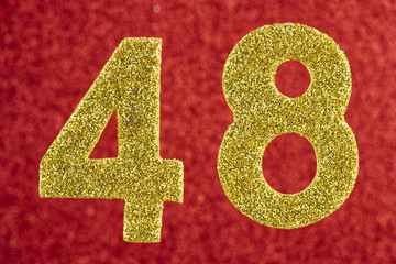 Number forty-eight gold color over a red background. Anniversary