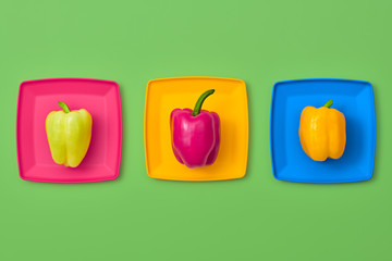 Pepper Fresh Veg. Food Organic Vegan Concept. Flat lay. Trendy fashion Style. Minimal Design Art. Hot Summer Vibes. Colorfull Vegetables. Pepper on plate. Bright Green Color.