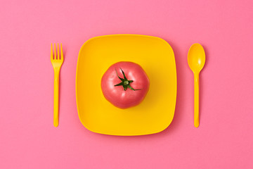 Tomato Fresh Veg. Food Organic Vegan Concept. Colorfull Vegetables. Pink Tomato on plate. Flat lay. Trendy fashion Style. Minimal Design Art. Hot Summer Vibes. Bright Green Color.
