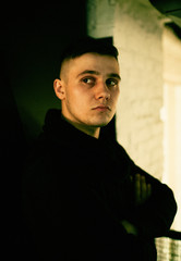 Fototapeta premium Portrait of handsome young man in black sweater