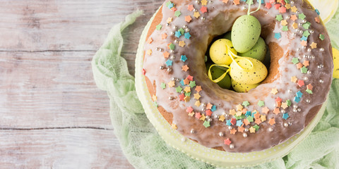 Easter ring cake with decorative festive eggs and sprinkles