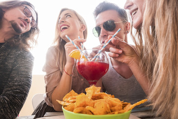 group of friends having fun togheter drinking