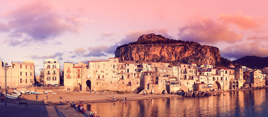 Obraz premium Panoramic view of Cefalu at sunset, little town on the sea in Sicily, Italy